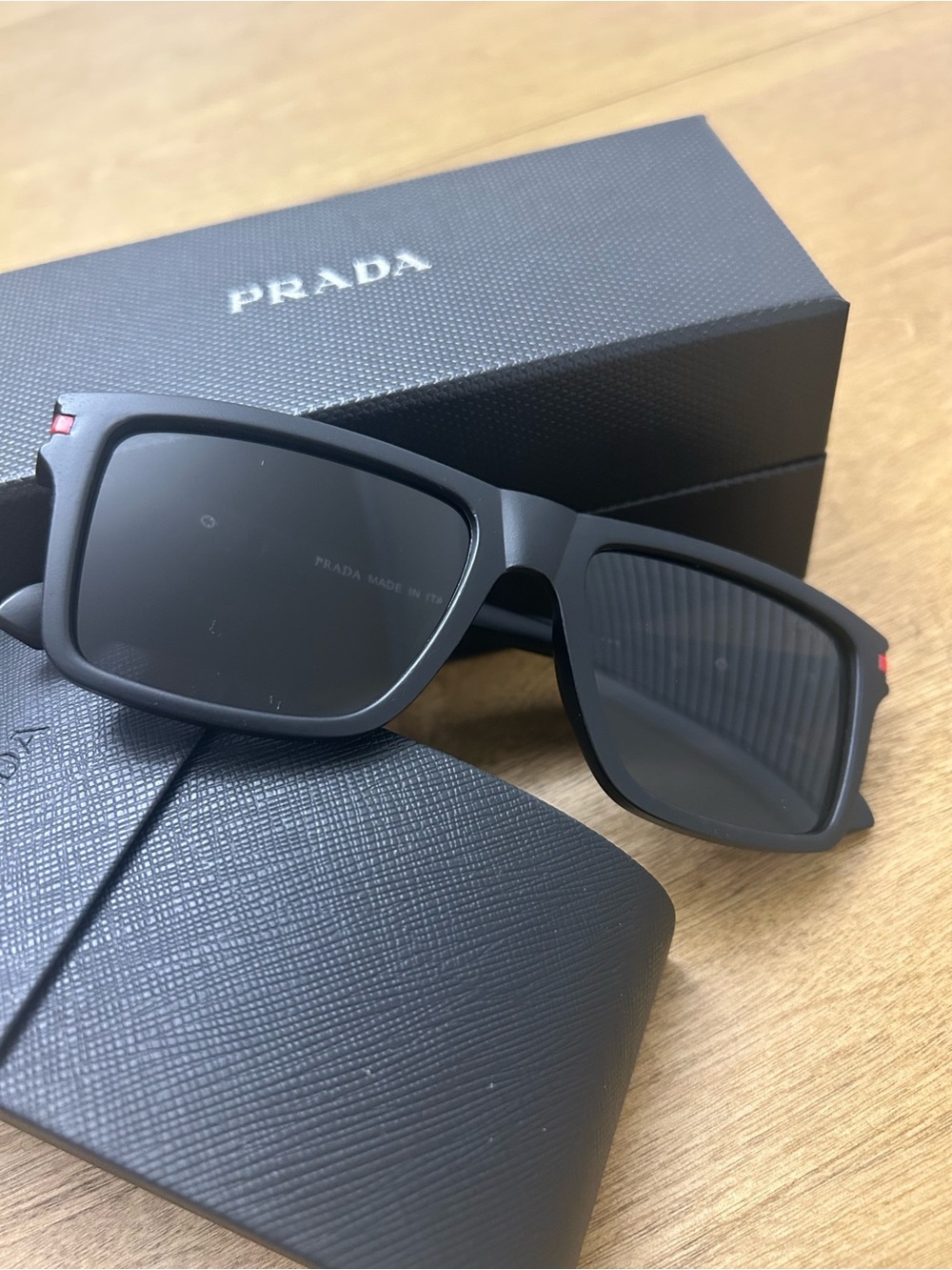 Prada Black Rectangular Sunglasses with Red Accent